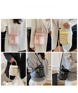 Model display of quilted cylinder bucket bags in multiple colors with crossbody straps