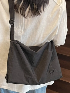 Large black canvas crossbody travel bag for women with BNT embroidery on stairs