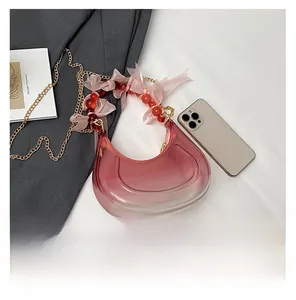 Pink gradient crescent handbag with beaded silk ribbon handle and gold chain strap detail
