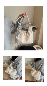 Detail of soft cream leather tote with knotted handle and large padded star charm