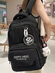 Stylish black high-capacity student backpack with Happy Mind print and white bear charm