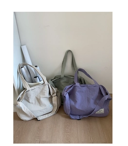 Nylon tote bags in off-white, green and purple colors with adjustable shoulder straps