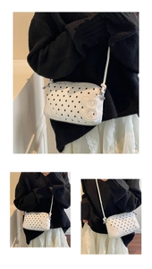Detail of white polka dot crossbody bag with 3D embossed logo and thin shoulder strap