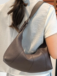 Brown lychee leather crescent shoulder bag with vintage minimalist baguette styling