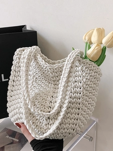 Handmade cream crochet tote bag with woven texture for summer beach vacations and daily use