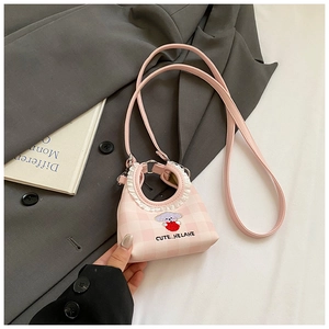 Detail of pink plaid mini bucket bag with cute embroidery and white lace trim