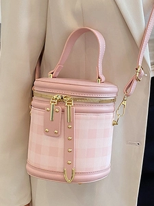 Chic pink quilted cylinder bucket bag with stylish plaid pattern and top handles