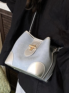 Chic light blue textured bucket bag with silver panels and gold turn-lock for women