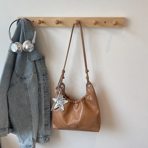 Brown pleated PU tote bag featuring a star pendant and elegant brand embossing