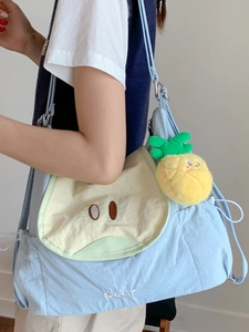 Cute light blue nylon shoulder bag with pear embroidery and pineapple plush charm