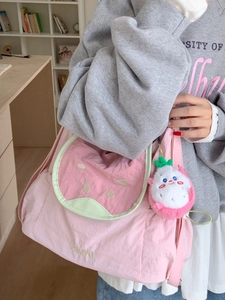 Pink canvas fruit-themed tote bag with watermelon lid and dragon fruit plush charm