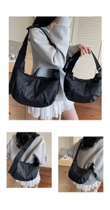 Detail view of black nylon crossbody bags in large and small sizes with multiple zip pockets