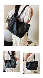 Detailed view of the black PU leather tote bag featuring elegant golden metal buckle and logo