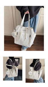 Detail of white canvas tote bag with small round coin purse and printed brand logo