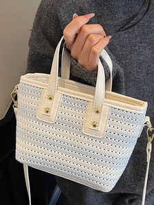 Summer woven white straw bucket bag with gold rivets and leather crossbody strap