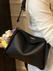 Minimalist black lychee pattern leather shoulder bag with flip cover and bear pendant