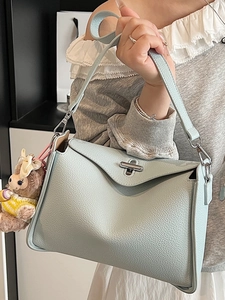 Chic light blue litchi pattern shoulder bag with cute plush sheep pendant for women