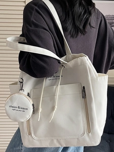 Minimalist white large canvas tote bag for women with round pendant and multi-pockets