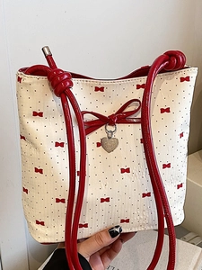Sweet cream bucket bag with red bow print and heart pendant charm for women