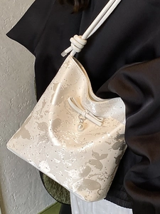 Chic cream-colored bow shoulder bucket bag with butterfly print and pearl charm
