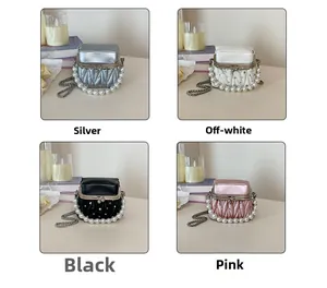 Detail view of quilted mini bags in silver, beige, black, and pink with pearl handles