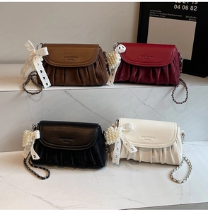 Mini soft leather cloud bags in four colors featuring pearl heart charms and chain straps