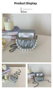 Detailed views of a silver mini pearl handbag with V-quilted faux leather and chain strap