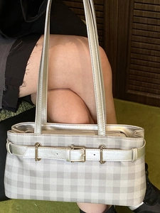 Silver-grey checkered underarm bag with gold buckle detail and double straps