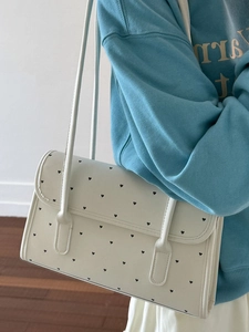 Chic beige shoulder bag with black heart prints and thin double straps for summer
