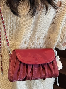 Chic burgundy pleated cloud crossbody bag with silver chain strap and charm
