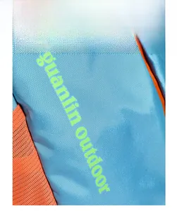 Macro view of water-resistant synthetic fiber fabric in blue and orange outdoor backpack
