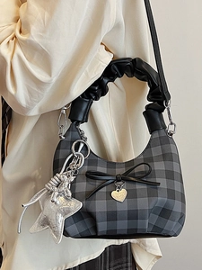Chic plaid hobo bag with a pleated handle, heart pendant, and silver star charm detail
