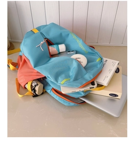 Detailed interior of high-capacity blue and orange backpack showing organized storage space