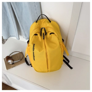 Detail of bright yellow waterproof school backpack with side mesh pockets and front zipper