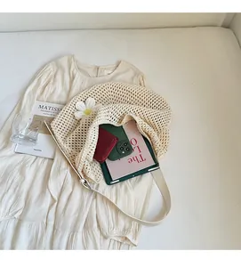 Detail of cream crochet shoulder bag showing spacious interior for daily essentials