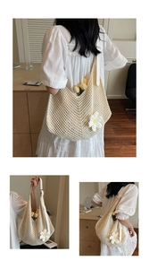 Detail of knitted crochet tote bag with 3D daisy flowers and adjustable leather strap