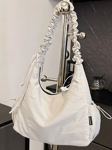 Chic beige pleated hobo bag for women featuring a stylish gathered shoulder strap design
