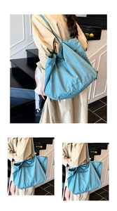 Detail of the blue large-capacity tote bag featuring San Francisco printed text and wide straps