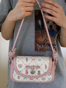Sweet pink bow crossbody bag with cute animal patterns and a heart metal charm