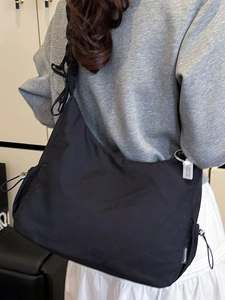 Minimalist black pleated nylon crescent crossbody bag for daily fashion commute