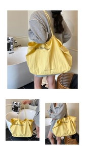 Collage of bright yellow San Francisco tote bag showing hand-carry and shoulder-carry views