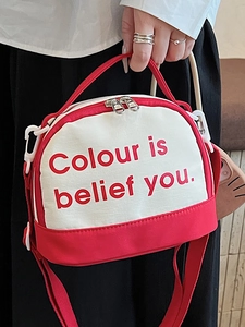 Red and white canvas crossbody bag with the slogan Colour is belief you for students