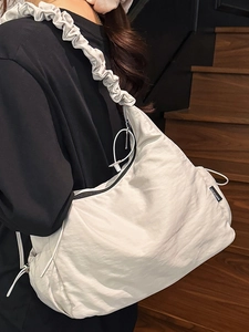 Chic pleated crossbody bag in off-white nylon with drawstring closure for casual wear
