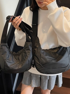 Minimalist black nylon crescent moon crossbody bags in small and large sizes for women