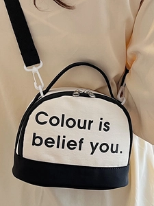 Minimalist black and white canvas crossbody bag with adjustable strap for students