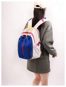 Detail view of colorful outdoor backpack showing padded straps and mesh side pockets