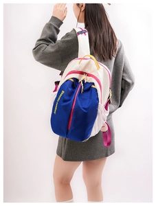 Detail view of colorful outdoor nylon backpack with multi-color splicing and mesh side pockets