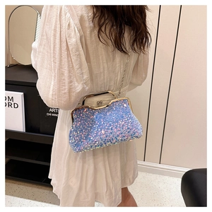 Close-up of holographic blue sequin handbag with kiss-lock clasp and silver chain strap
