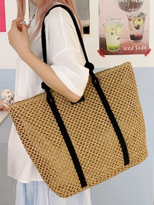 Large capacity woven straw tote bag with black canvas straps for summer beach vacations