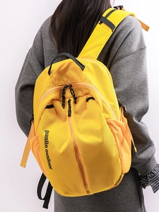 Waterproof yellow nylon student backpack with large capacity for outdoor activities